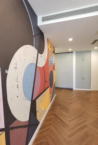 an empty room with a large painting on the wall at River House Near The Peoples Square And The Bund in Shanghai