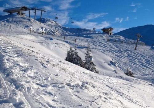 a snow covered ski slope with a ski lift at Villard-de-lans studio au pied des pistes pour 4 pers in Villard-de-Lans