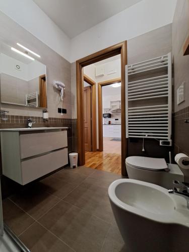 a bathroom with a sink and a tub and a toilet at Angy's house Roma in Rome