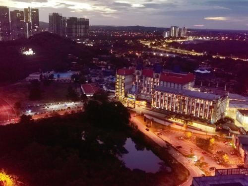 a view of a city at night with lights at Legoland-4mins Walk-Spacious-Kids Friendly with Bathtub@ Happy Travel- AFINITY RESIDENCY in Nusajaya