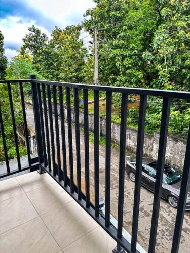 a black railing on a balcony with a car at 2 Bedroom Apartment - Aurora Residences Maharagama in Maharagama