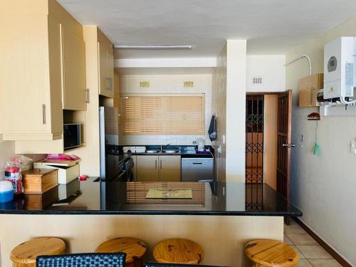 a kitchen with a counter top in a room at Ramsgate Beach house in Margate