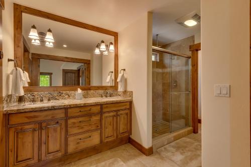 a bathroom with a double sink and a shower at Hawk's Peak at Tahoe Donner in Truckee