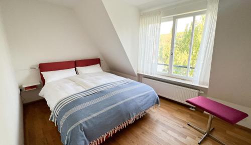 Vuode tai vuoteita majoituspaikassa Schönes Dachgeschoss-Apartment mit Mainblick