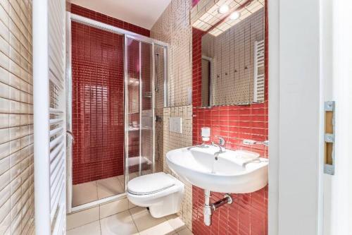 a bathroom with a toilet and a sink at Cosy Apartment for 4 / Old Town / Jewish Quarter in Prague