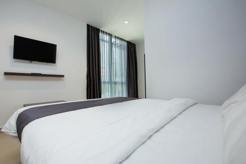 Un ou plusieurs lits dans un hébergement de l'établissement 1 Hotel Signature