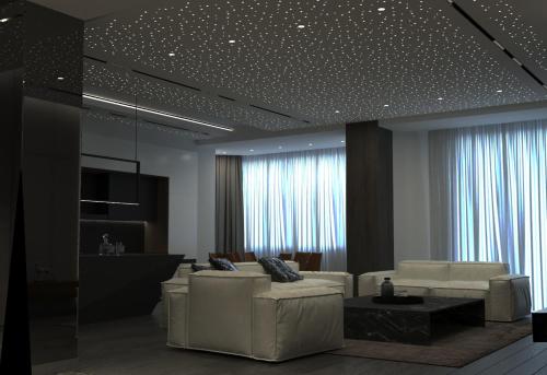 una sala de estar con muebles blancos y estrellas en el techo. en Dubai Marina Amazing VIP Apartment, en Baku