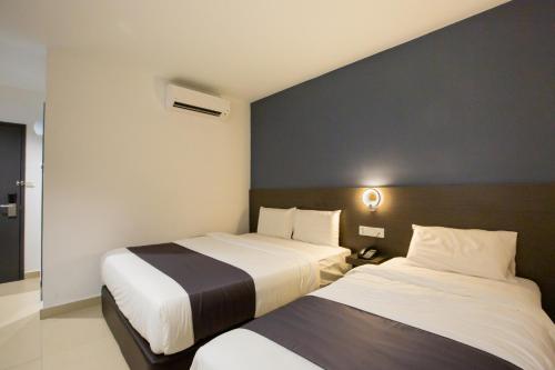 Un ou plusieurs lits dans un hébergement de l'établissement 1 Hotel Signature