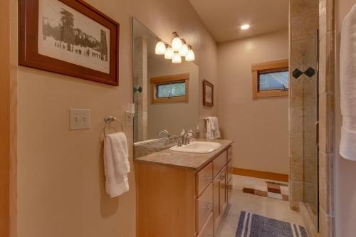 a bathroom with a sink and a shower at Tahoe Time on North Shore - 4 BR Cabin w Private Hot Tub, Pet Friendly, Walk to Dining in Tahoe Vista