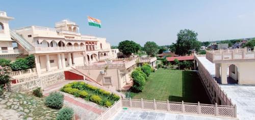 an aerial view of a house with a yard at Fort Beejwar Chauhan by AAYAMs Neemrana in Shāhjahānpur