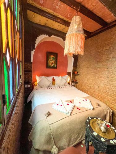 En eller flere senge i et værelse på Riad Elli Marrakech