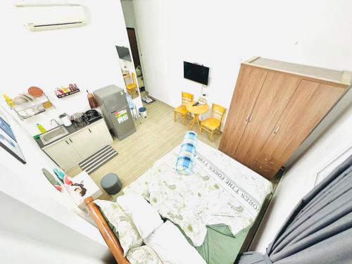 an overhead view of a room with a bed and a kitchen at Cozy & Quiet 1BR Oasis in the heart of Ho Chi Minh City in Ho Chi Minh City