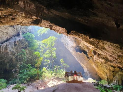 a cave with a building inside of it at S&F villa in Sam Roi Yot