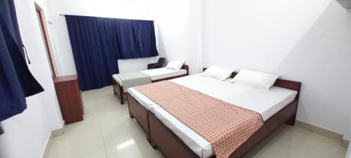 Cama o camas de una habitación en Mahadev Home Stay
