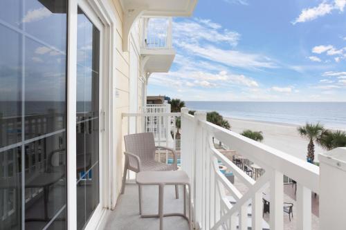 a balcony with a view of the beach at SpringHill Suites by Marriott New Smyrna Beach in New Smyrna Beach