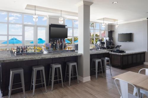 a bar with a view of the ocean at SpringHill Suites by Marriott New Smyrna Beach in New Smyrna Beach