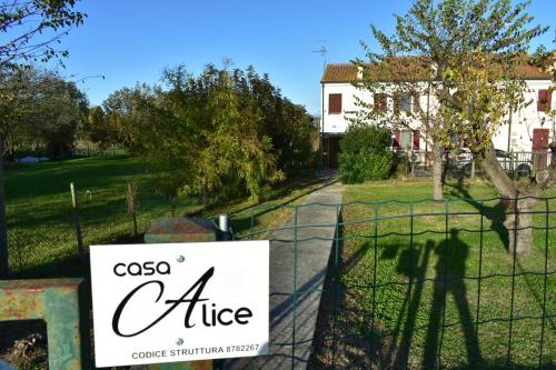 a sign on a fence in front of a house at Casa Alice in Raccano