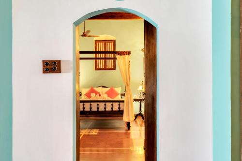 a view of a bedroom through a doorway at Villa Sereno by Insignia Villas in Assagao