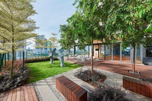 a garden with a statue in the middle of a building at Grand Medini, Iskandar Puteri, Johor in Nusajaya