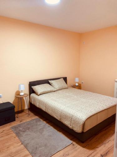 a bedroom with a bed and two night stands at Aleksa in Novi Grad