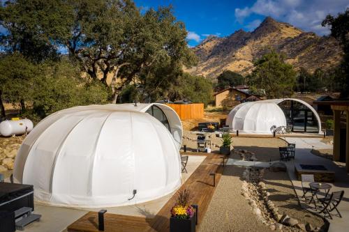 a group of domes with mountains in the background at Sequoia Studio Suites in Three Rivers