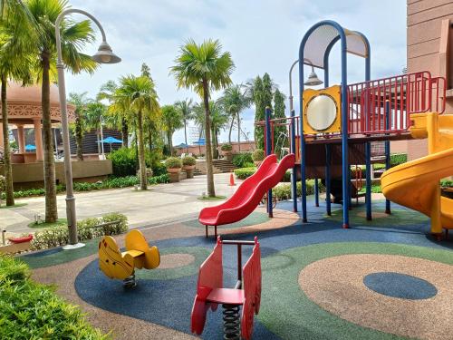 a playground with a slide in a park at Times Square Apartment By Skyline in Kuala Lumpur