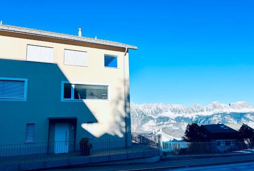 a building with a view of a mountain at Panorama View - CharmingStay in Flumserberg