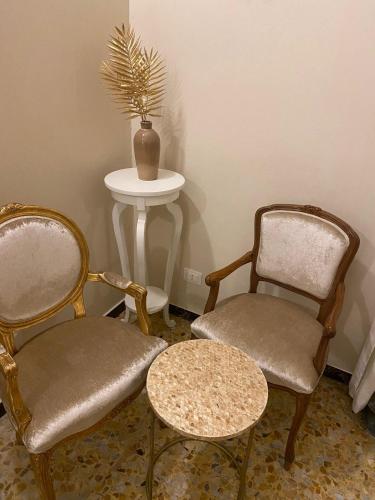 two chairs and a table in a room at Best Apartment in Florence in Sesto Fiorentino