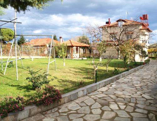 a park with a swing set in a yard at VILLA LA LUNA in Leptokaria