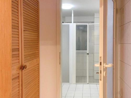 an open door to a bathroom with a shower at T&K Apartments - Wegberg - 3-6 Zimmer Apartments in Wegberg