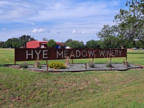 a sign that says live meadowwywxwxwxwxwx at The Container Retreat at 290 Wine Trail #2 Adventure awaits! in Hye