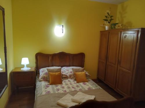 a bedroom with a bed with two towels on it at Bębenkowie in Białka Tatrzanska