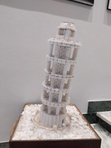 a cake shaped like a lighthouse on a table at Casa di Giulia (Bambini gratis fino a 6 anni) in Santa Luce
