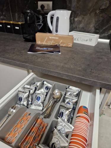 a drawer filled with utensils on top of a counter at casa Hanna2 in Intra