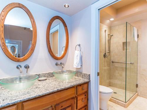 a bathroom with two sinks and a shower at 223 Forest Pines short walk to bike path and the Hyatt Casino in Incline Village