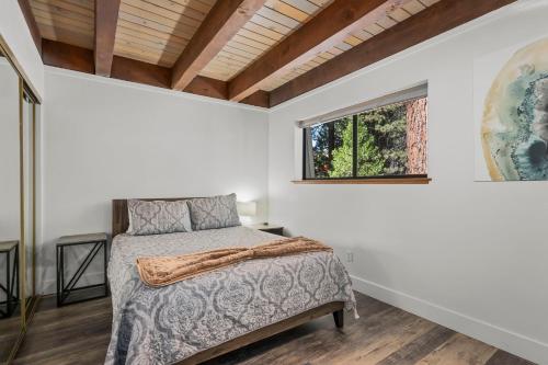 a bedroom with a bed and a window at Incline Village Championship Golf Coarse Retreat in Incline Village