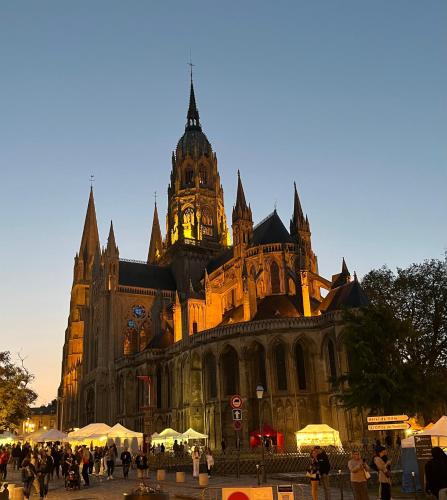 a large building with a clock tower on top of it at Bayeux in Bayeux