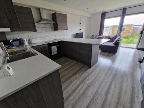 a kitchen with a sink and a counter top at St Marks Lodge Clacton-On-Sea in Shotley Gate