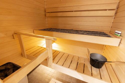 an inside of a sauna with a bed in it at Stylish Scandinavian Suite - Sauna, Harbor & Free Parking in Helsinki