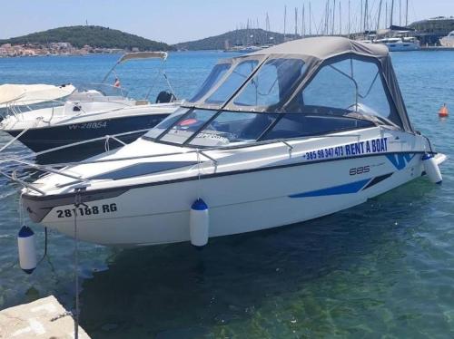 two boats are docked in the water at Vacation house with heated swimming pool 70 meters from the beach-Bobanac in Ražanj