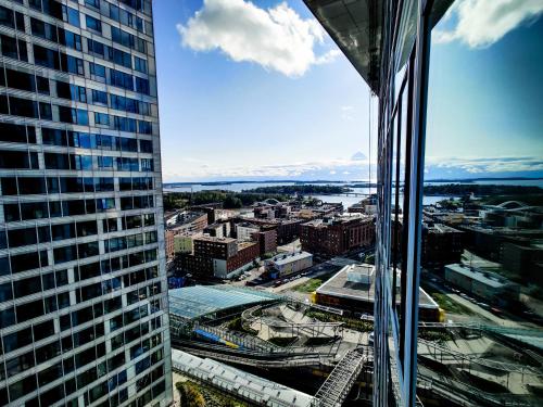 a view of a city from a skyscraper at 18th Floor Helsinki High Point 1 BDR Apartment with City View - Free Garage Parking in Helsinki