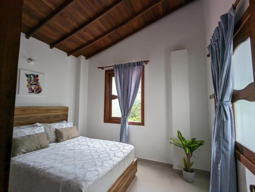 Postel nebo postele na pokoji v ubytování OCASSO JARDIN APARTAMENTO GALLITO DE ROCA