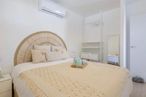 a bedroom with a bed with a teddy bear on it at Sea light in Puerto del Carmen