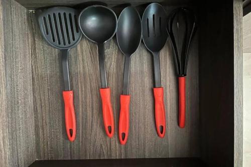 a group of utensils hanging from a wall at Hermoso y Cómodo Apartaestudio 703 in Medellín