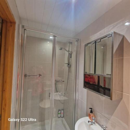 a bathroom with a shower and a sink at 4 Bed Park View House-Free Parking - Sleep 8 in Plymouth