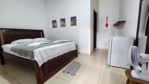 Katil atau katil-katil dalam bilik di Vila Shangri-la Algodoal- Suítes e Redário