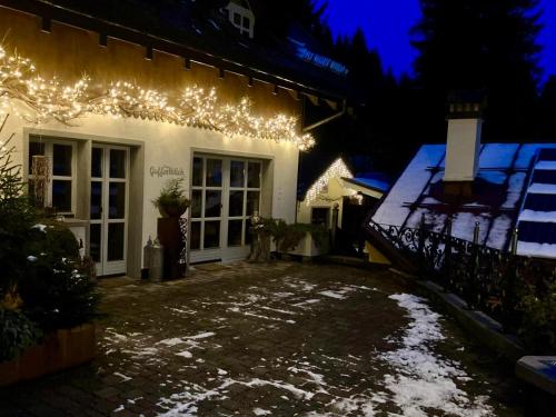 a house with christmas lights on the side of it at Guffertblick in Achenkirch