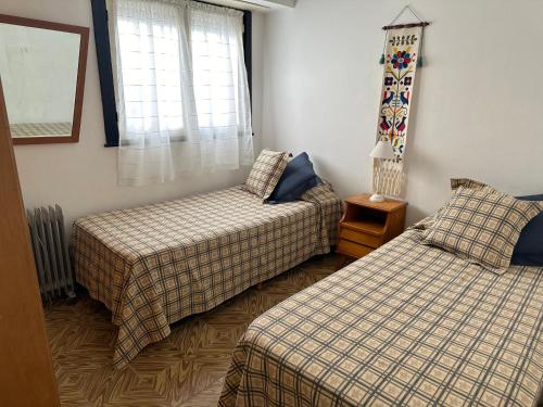 Ένα ή περισσότερα κρεβάτια σε δωμάτιο στο La casa de Chola