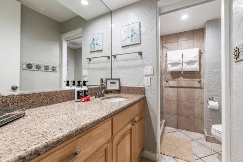 a bathroom with a sink and a shower at Papakea E206- Updated Papakea oceanview condo, all the amenities in Kahana