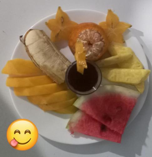 a plate of food with fruit and sauce on it at Vista Alta Ecolodge Bahia Drake in Drake